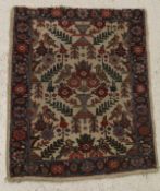 A Tabriz rug, the central panel set with all over bird and floral motifs on a cream ground,