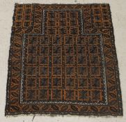 A Belouch prayer rug, the whole set with repeating square motifs in orange, black and cream,