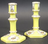 A pair of late 19th/early 20th Century Berlin porcelain candlesticks,