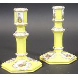 A pair of late 19th/early 20th Century Berlin porcelain candlesticks,