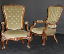 A pair of Victorian walnut framed salon chairs with carved floral show frames, button back,