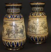 A pair of Doulton Lambeth vases decorated with stags and deer in a landscape by Hannah Barlow 1883