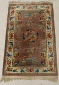 Three matching Chinese rugs, the central panels each set with landscape design,