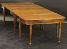 An early 19th Century mahogany D-end dining table with plain mahogany top,