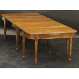 An early 19th Century mahogany D-end dining table with plain mahogany top,