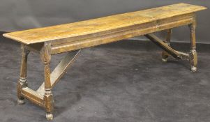 An 18th Century oak stool,