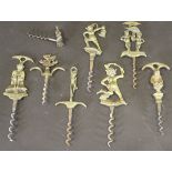 A collection of brass handled corkscrews, variously decorated with the Dartmoor Pixie,