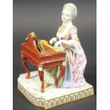 A 19th Century Meissen figure group of a lady seated at a piano from the Senses Series "Sound",.