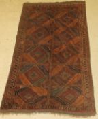 A Bokhara type rug, the central panel set with two rows of repeating diamond shaped medallions,