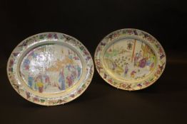 Two early 19th Century Chinese famille-rose polychrome decorated armorial ware oval platters,