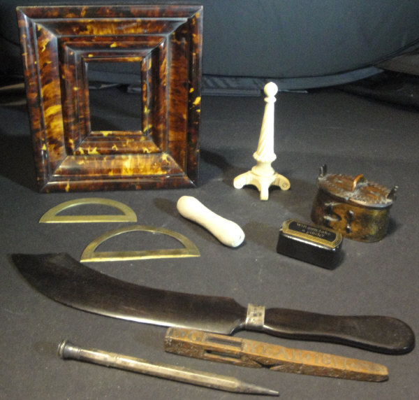 A box containing a tortoiseshell picture frame, 17.4 cm x 15.