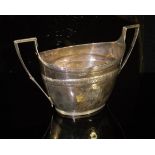 A George III silver twin-handled sugar basin of boat form with engraved knot decorated band above