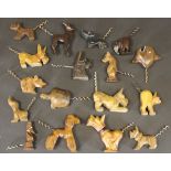 A collection of novelty corkscrews each carved with a wooden animal including Scottie Dog, Cat,