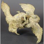 A bronze figure group of a pair of eagles fighting,indistinctly stamped "Geschutz", approx 14.