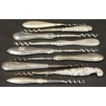 A collection of nine various silver handled steel Helix scent bottle or small travelling corkscrews