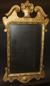 An early 18th Century giltwood and gesso wall mirror,