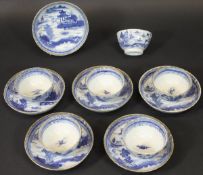 A set of six 19th Century Chinese blue and white and gilt decorated tea bowls and saucers,