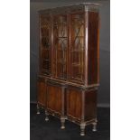 An Edwardian mahogany Chippendale Revival breakfront bookcase,