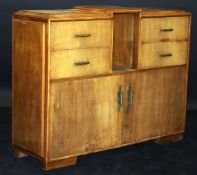 A 1920's French Art Deco walnut veneered cabinet by Dominique of Paris,