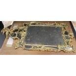 A George III gilt wood and gesso framed wall mirror in the Rococo taste,