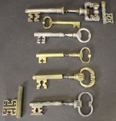 Six various brass and steel corkscrews in the form of large keys,