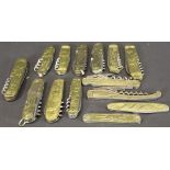 A collection of various brass cased penknives, pocket knives and bottle openers,