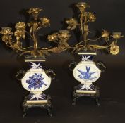 A pair of late 19th Century Royal Worcester porcelain and gilt bronze candelabra in the Aesthetic