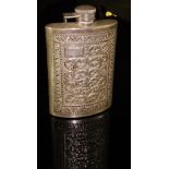 A 20th Century Indian hip flask profusely decorated with scrolling foliate pattern,