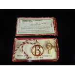 A cased set of two Brooklands Automobile Racing Club badges from 1936, No'd.