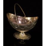 A Victorian silver swing-handled sweetmeat bowl of boat-shaped form,