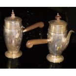 A pair of George V silver cafe au lait pots with turned wooden finial and wooden handle,