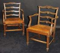 A set of eight 20th Century mahogany framed pierced ladder back dining chairs with arms in the