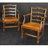 A set of eight 20th Century mahogany framed pierced ladder back dining chairs with arms in the