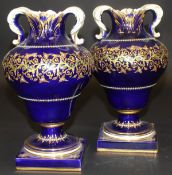 A pair Sèvres "Bleu Royale" ground vases of inverted pear form with foliate decorated rim and