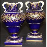 A pair Sèvres "Bleu Royale" ground vases of inverted pear form with foliate decorated rim and