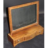 An early 19th Century mahogany and cross banded toilet mirror with rectangular plate on a break