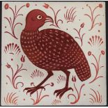 William de Morgan glazed pottery tile, decorated in ruby lustre with a quail,
