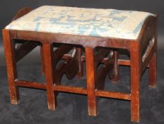 A mahogany stool in the George III taste, the upholstered drop-in seat,