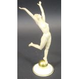 A Lorenz Hutschenreuther Art Deco figure of a nude dancing lady upon a gold ball designed by Carl