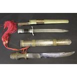 A 19th Century Middle Eastern white metal and bronze mounted dagger,