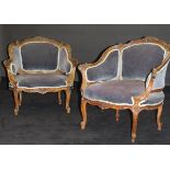 A pair of 19th Century French walnut salon chairs with carved foliate and shell show frames with