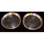 A pair of modern silver circular trays with applied rim, approx 12.6 oz total, 17.