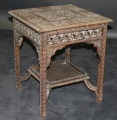 An Anglo-Indian square topped two tier occasional table,