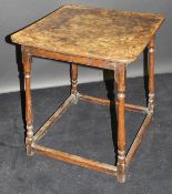 An early 19th Century oak occasional table, the square, burr brown oak top with rounded corners,