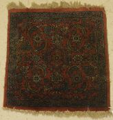 A Mahal rug, the central panel set with all over stylised floral decoration on a pink ground,