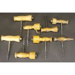 A collection of wooden handled Codd opener corkscrews,