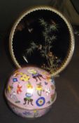 A Chinese cloisonné lidded bowl and decorated on a pink ground with a blue interior, 8 cm high,