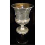 A George III silver urn-shaped vase, raised on pedestal base to circular foot, inscribed "D.