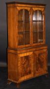 DAVID BERESFORD (AKA BERESOFSKY) An early 20th Century walnut and cross banded display cabinet with