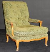 A 19th Century Continental walnut framed salon open armchair on cabriole legs with green foliate